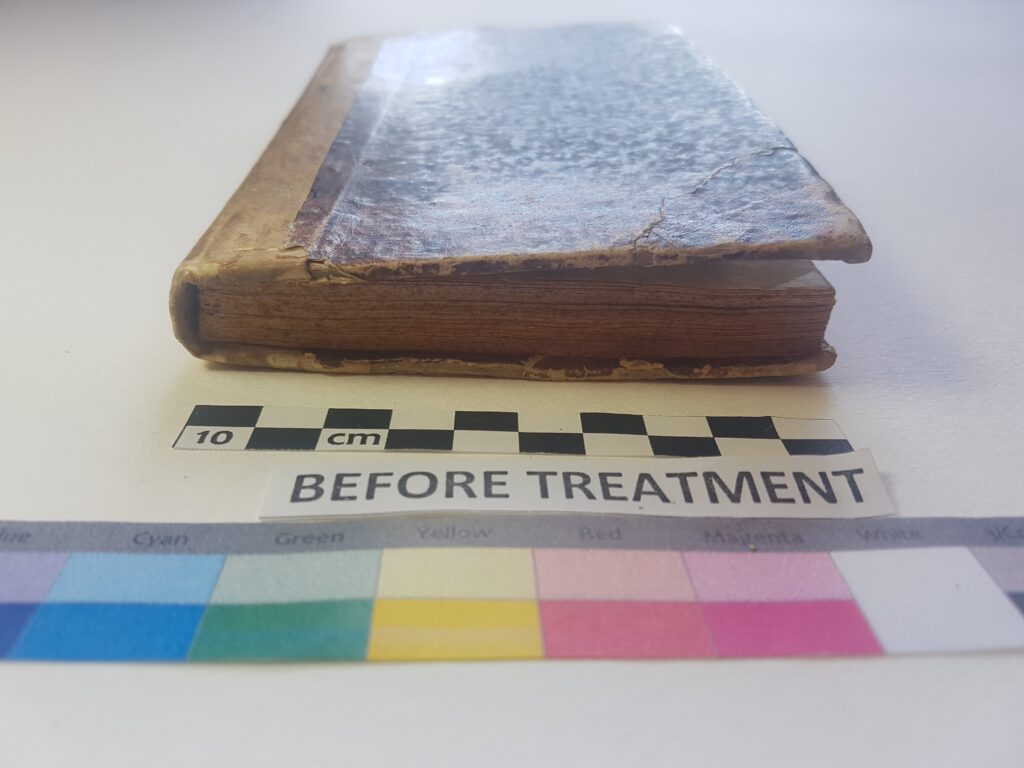 Book cover restoration before treatment